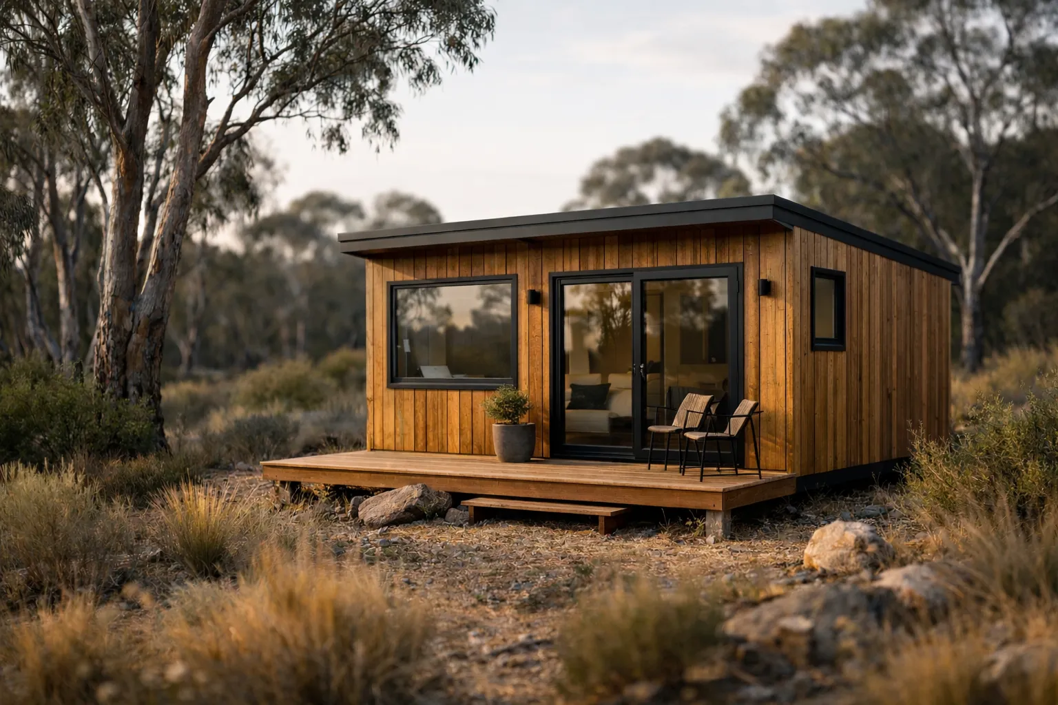 A modern tiny home with timber cladding nestled in Australian bushland